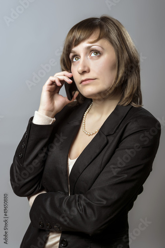 Young business woman with cell phone