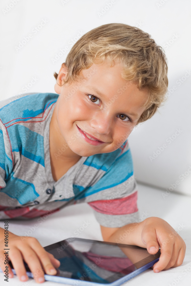 Smiling boy using a tablet Smiling boy using a tablet