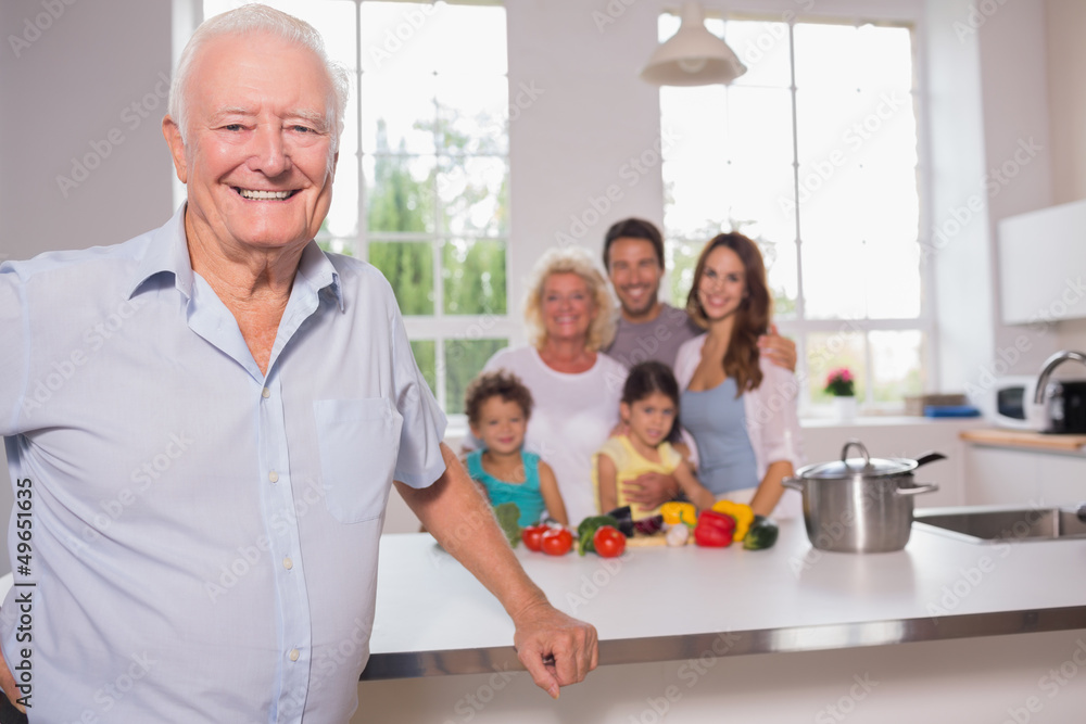 Grandfather in front of his family Grandfather in front of his family
