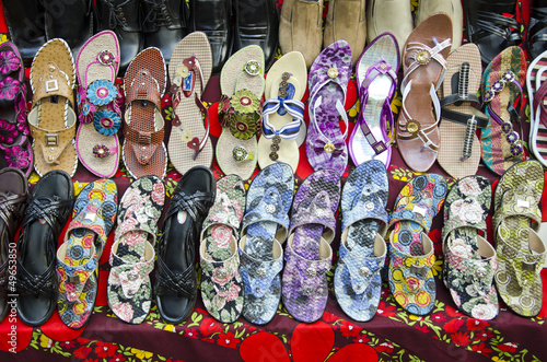various colorful shoes in India market