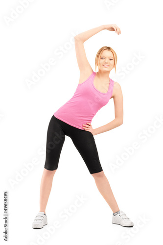 Full length portrait of a young female exercising