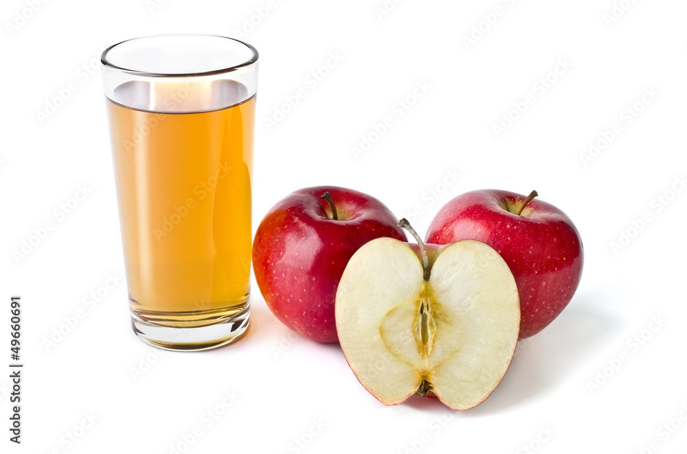 Glass of apple juice and red apples lying next isolated over whi Glass of apple juice and red apples lying next isolated over whi