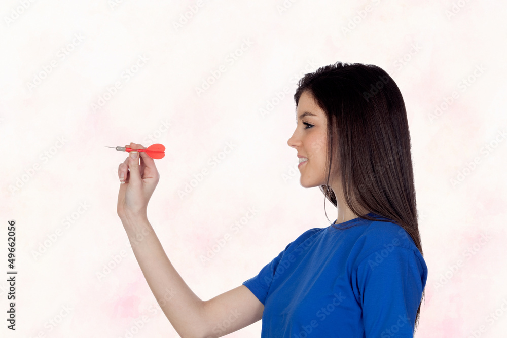 Attractive girl smiling throwing a dart