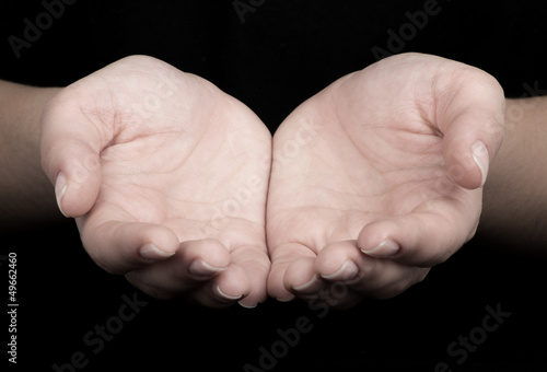Female hands as if holding something.