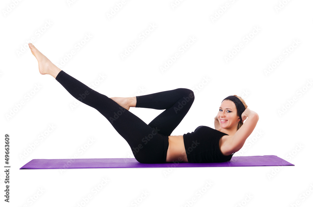 Young female doing exercises on white