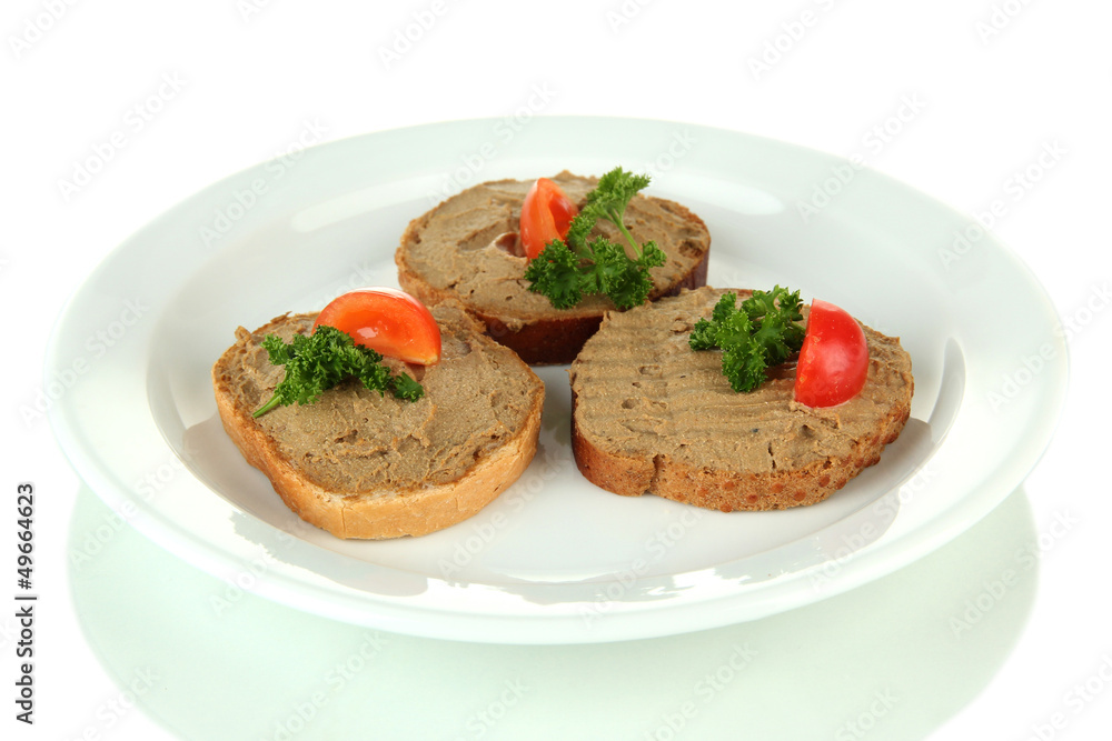 Toasted bread with pate on color plate, isolated on white