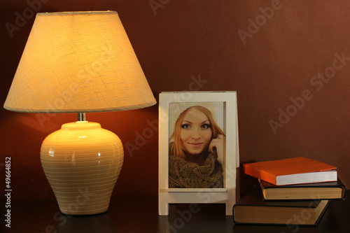 Fototapeta Naklejka Na Ścianę i Meble -  White photo frame and lamp
