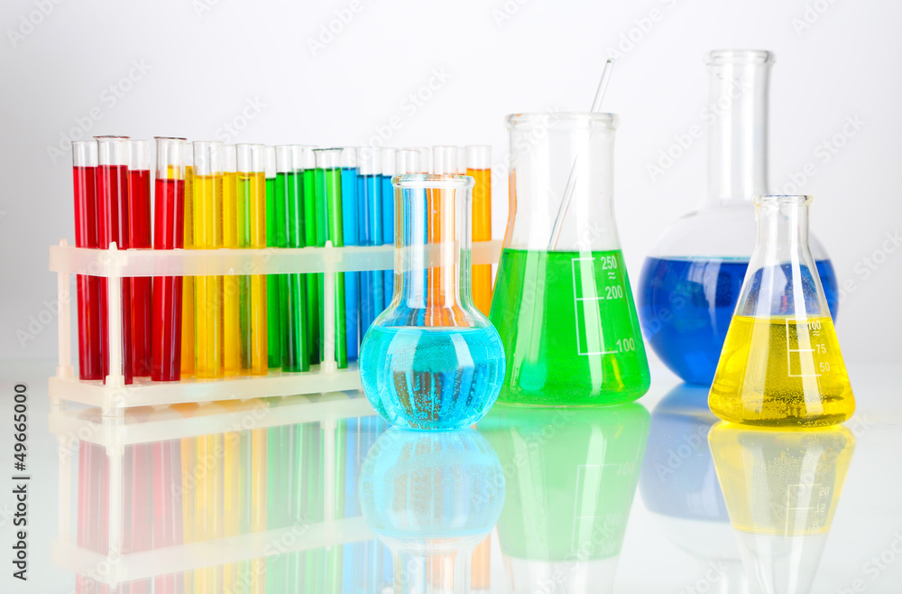 Test tubes with colorful liquids isolated on white Test tubes with colorful liquids isolated on white