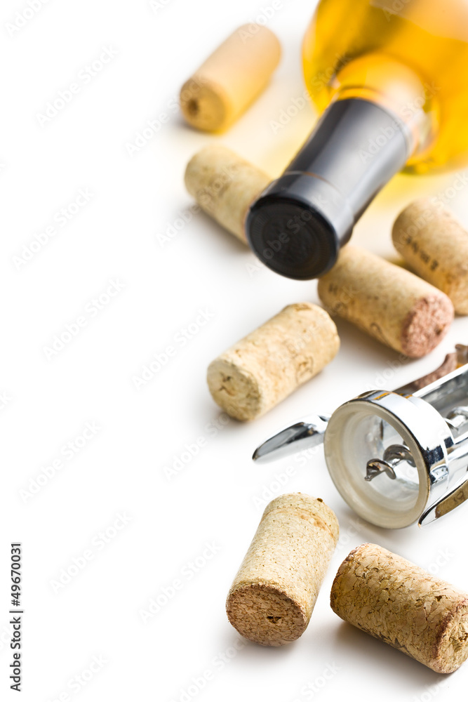 wine cork, corkscrew and bottle of white wine