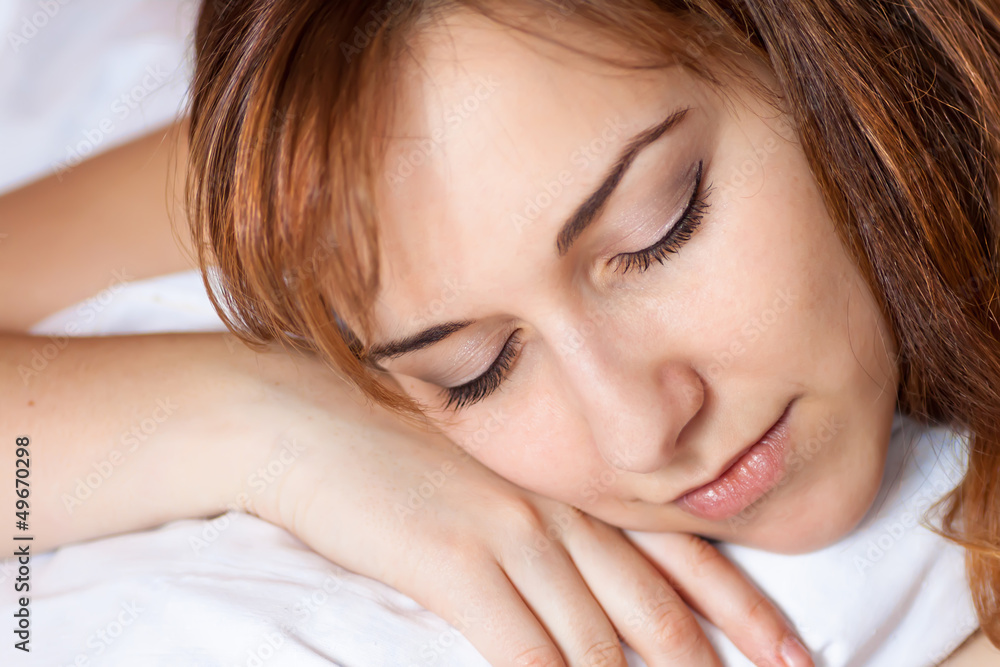 Closeup portrait of a beautiful young lady sleeps on the bed. Closeup portrait of a beautiful young lady sleeps on the bed.