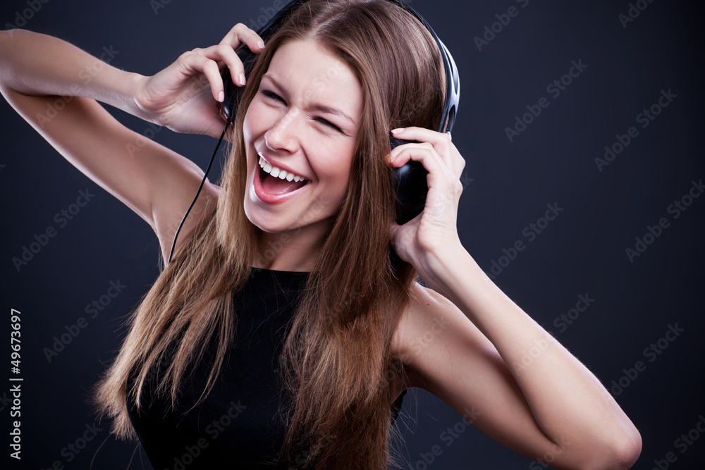 young beautiful woman enjoying the music on headphones young beautiful woman enjoying the music on headphones