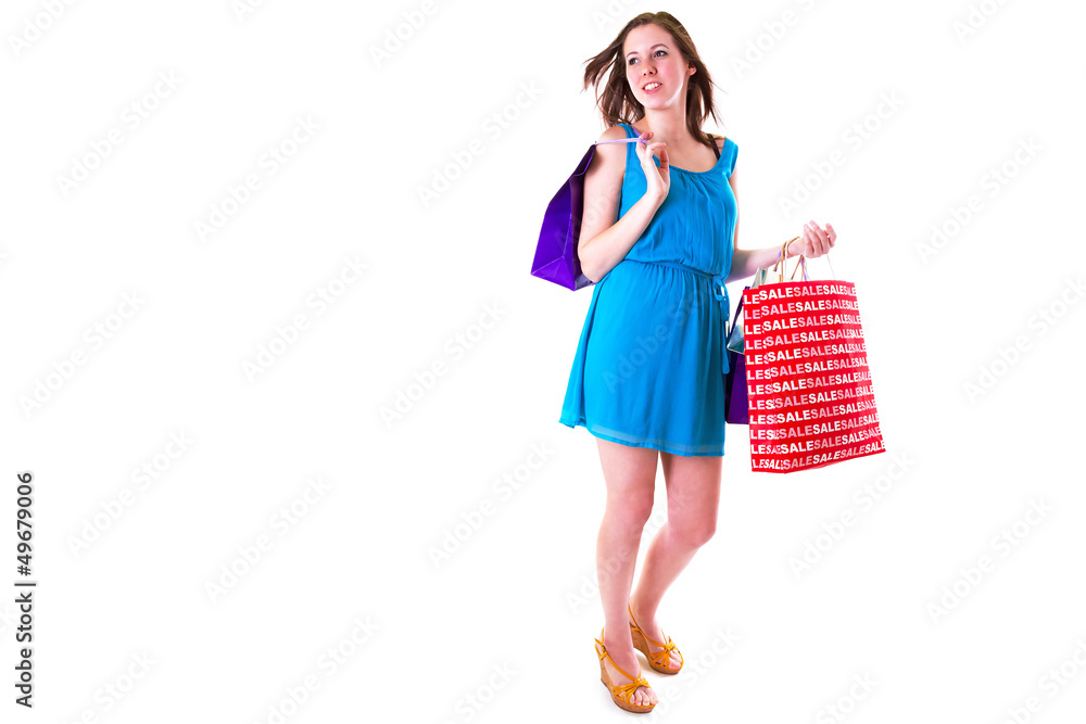 Attractive young female holding shopping bags isolated on white Attractive young female holding shopping bags isolated on white