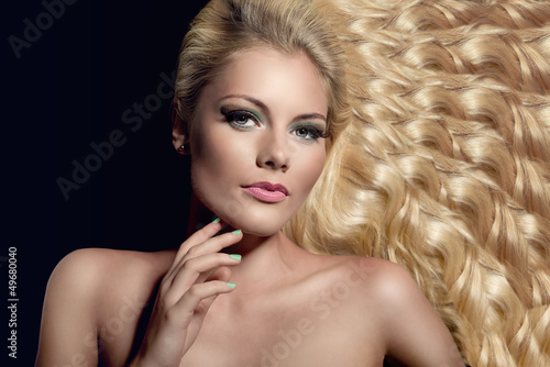 portrait of beautiful young blond woman with wavy hair