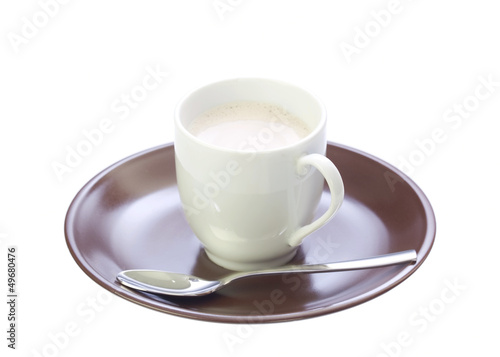 A cup with coffee on a brown saucer