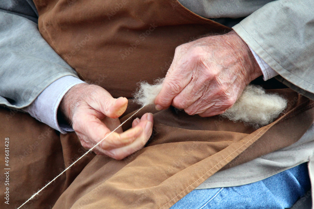 Old hands who spin the whitw wool