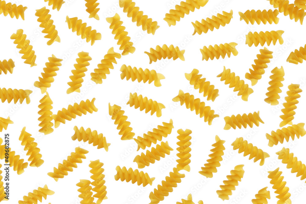 Fusilli dry pasta on a white background
