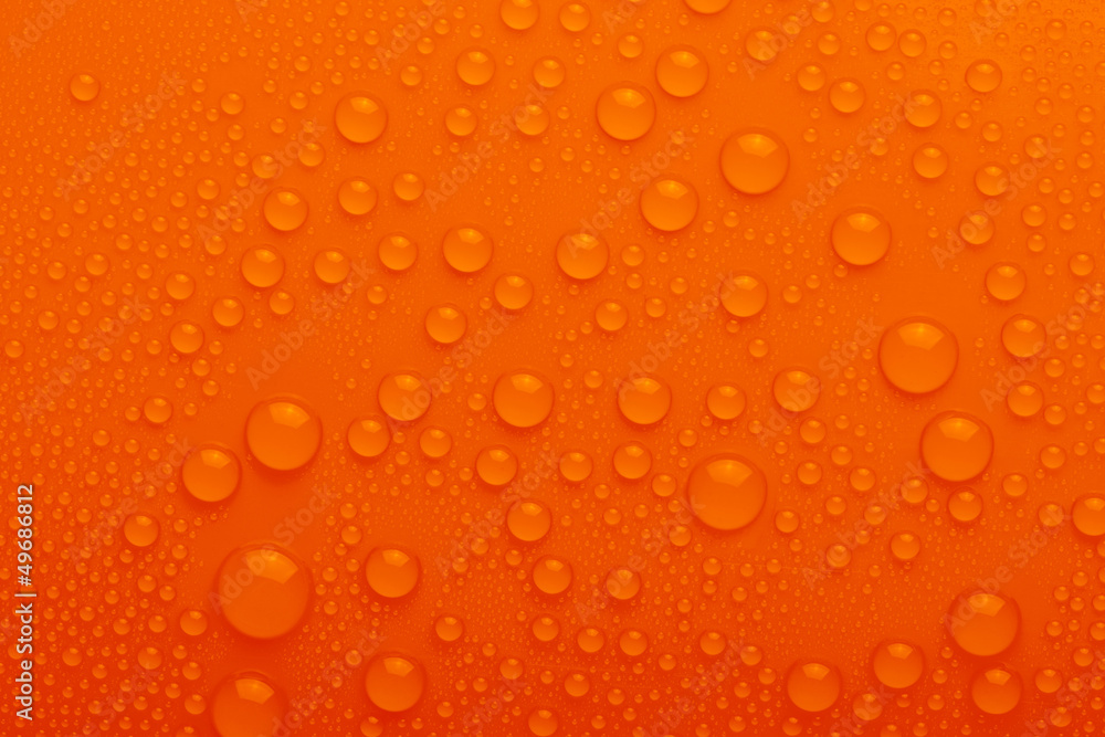 Water drops on orange background Water drops on orange background