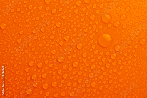 Water drops on orange background