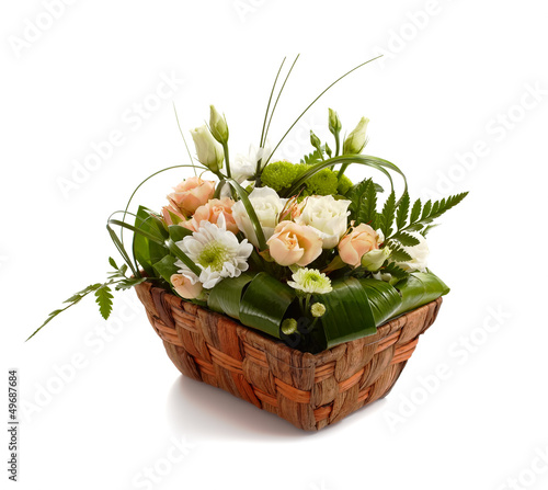 Basket with beautiful flowers isolated