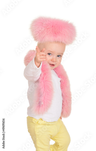 cute baby girl dressed in pink fur play on white background