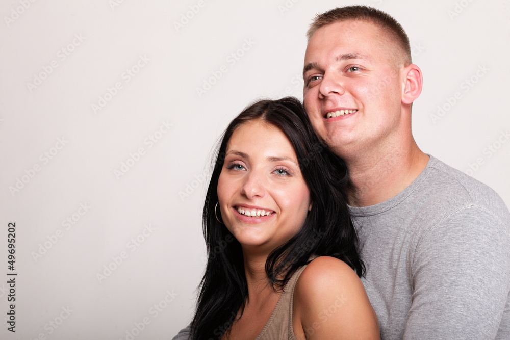 Portrait of a beautiful young happy smiling couple isolated Portrait of a beautiful young happy smiling couple isolated