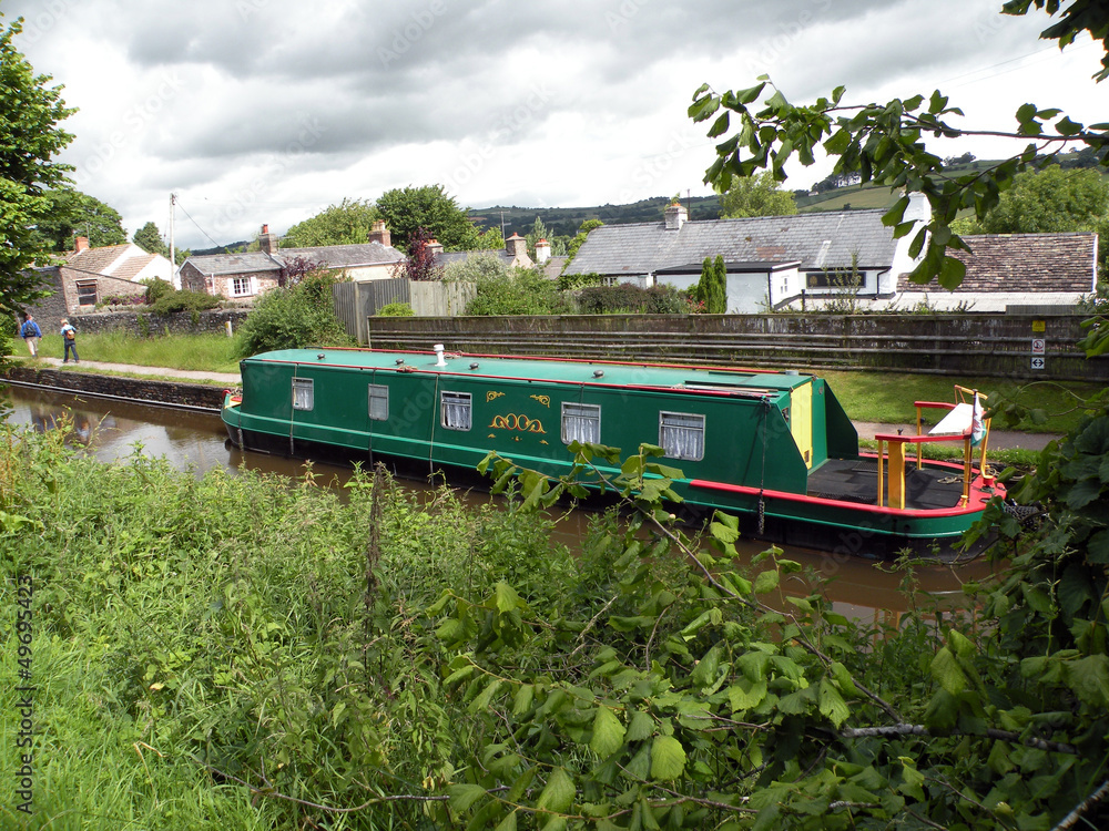 Green narrowboat in Great Britain