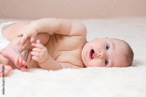 cute baby boy lying on his ...