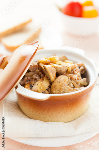 buckwheat with mushrooms in a ceramic pot