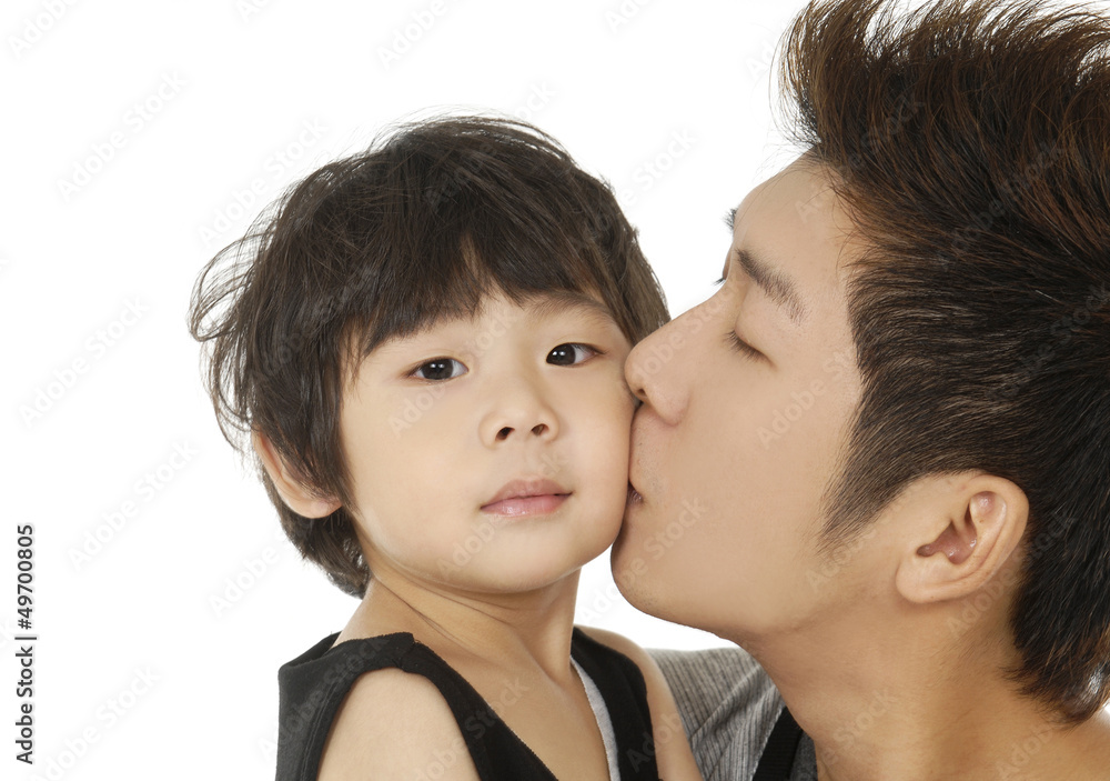 Happy love family with child - father kissing his son- closeup Happy love family with child - father kissing his son- closeup