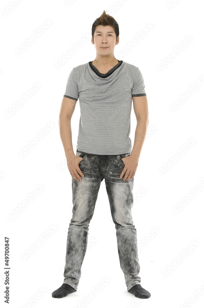 portrait of a young handsome guy holding hands on pocket portrait of a young handsome guy holding hands on pocket