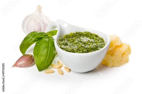 Pesto Genovese in a gravy boat and ingredients