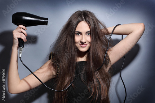 girl with hairdryer