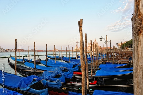 View to the gondolas and boats berth  in Venice. © Dmitriy Raykin