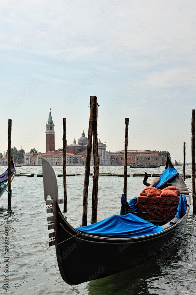 View to the gondolas and boats berth  in Venice.