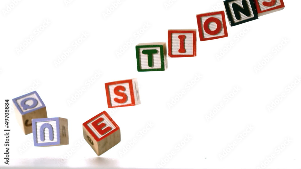 Blocks spelling questions dropping down on white background Blocks spelling questions dropping down on white background
