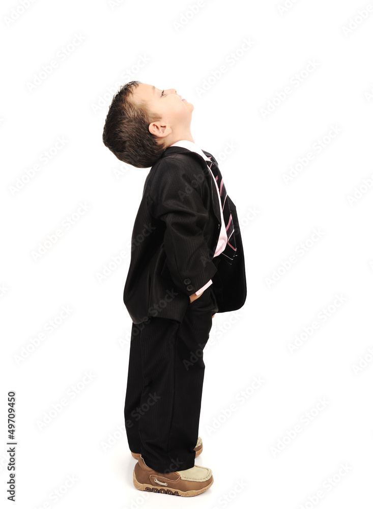Kid wearing suit isolated looking up Kid wearing suit isolated looking up