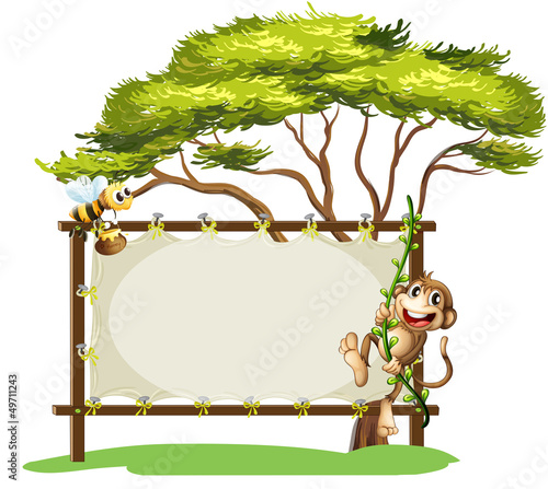 A monkey and the bee beside the empty signage