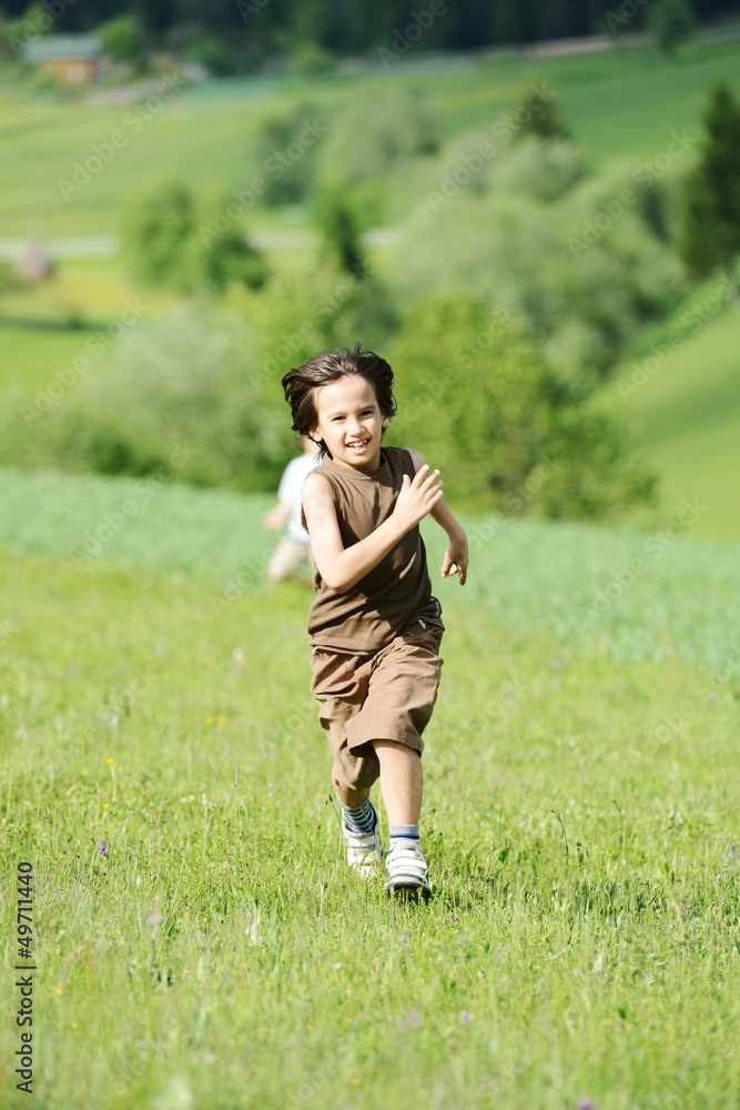 Child on green natural meadow Child on green natural meadow