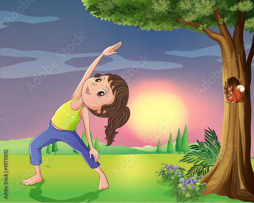 A girl exercising near a tree with squirrel