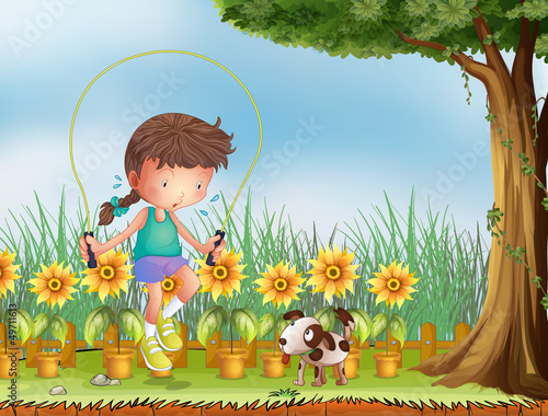 A girl playing jumping rope with a dog