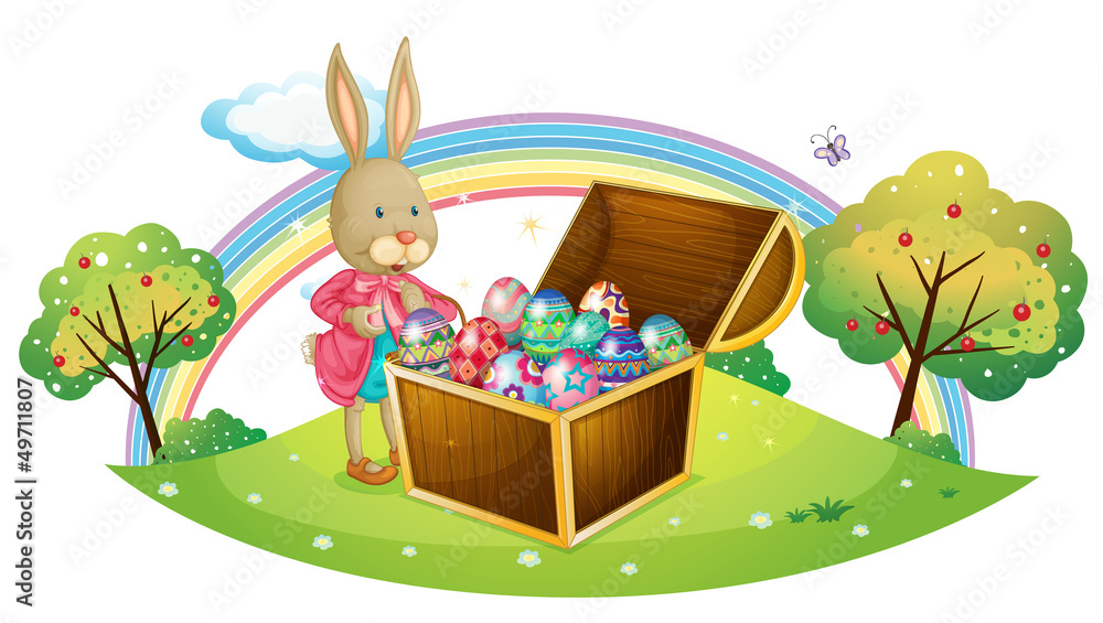 Fototapeta premium A bunny with many coloful eggs