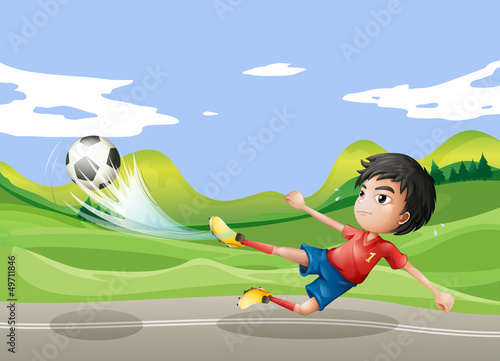 A player playing soccer at the street