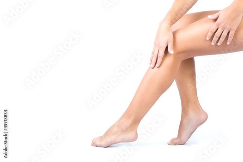Body care. Woman applying cream on legs © nenetus