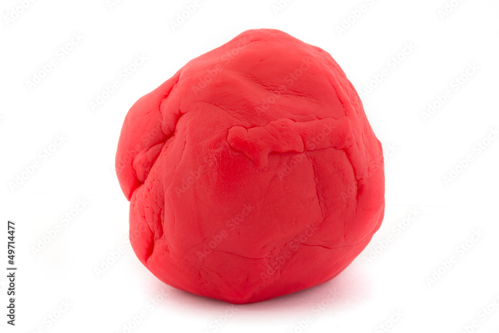 Ball of red play dough on white Ball of red play dough on white