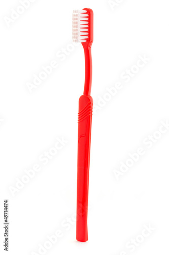 Fototapeta Naklejka Na Ścianę i Meble -  Single red toothbrush on white