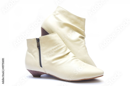 female beige boots on white background