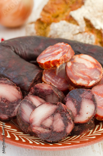 cut sausages with corn bread photo