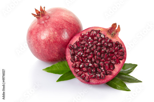 Pomegranate with leaves on white with clipping path