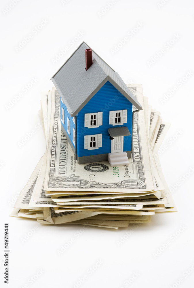 Model house on dollar bills isolated on white background Model house on dollar bills isolated on white background