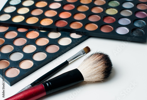 colorful eyeshadows and make-up brushes